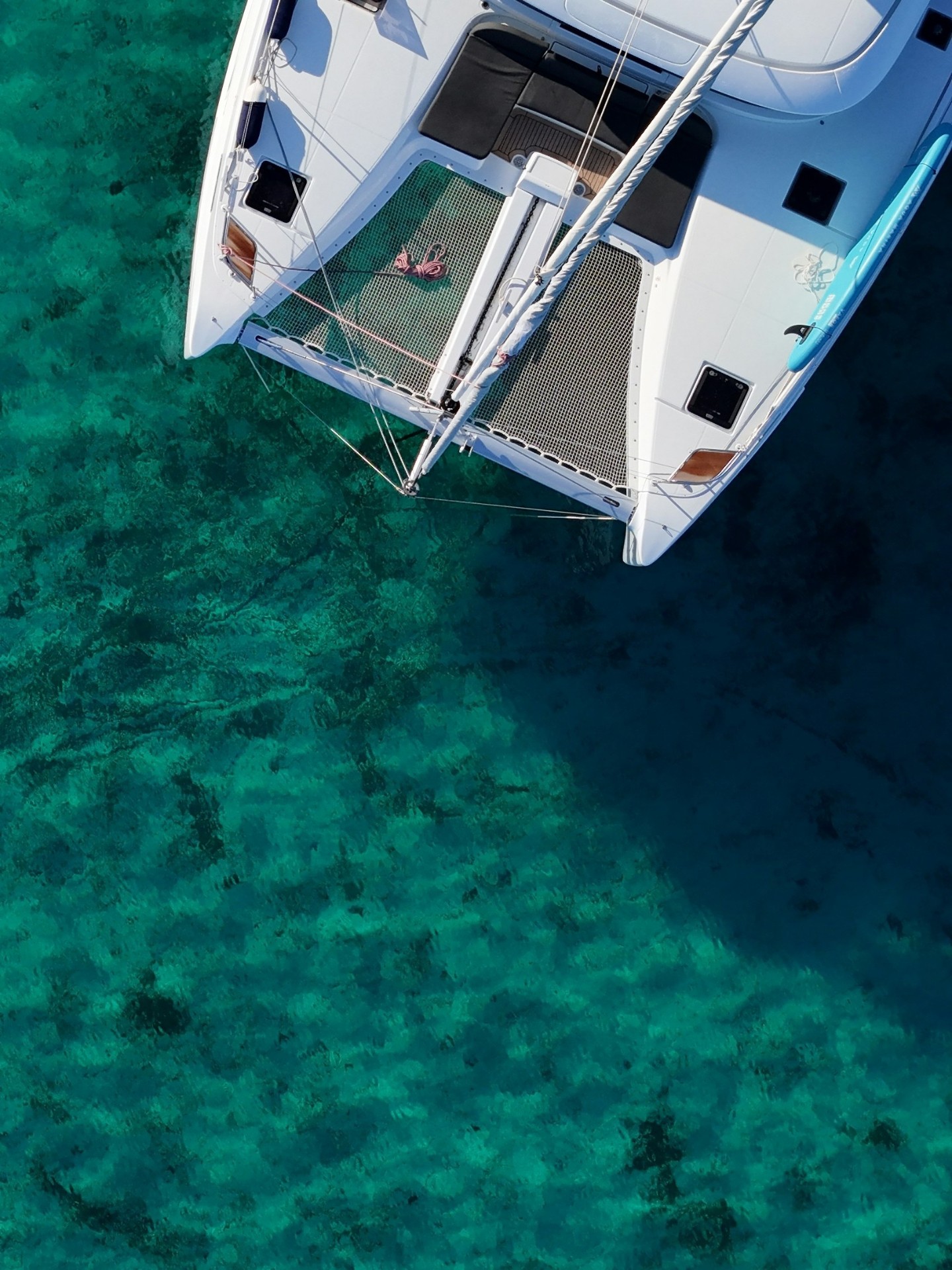 Aerial view of a Calabaza catamaran over turquoise Barbados waters